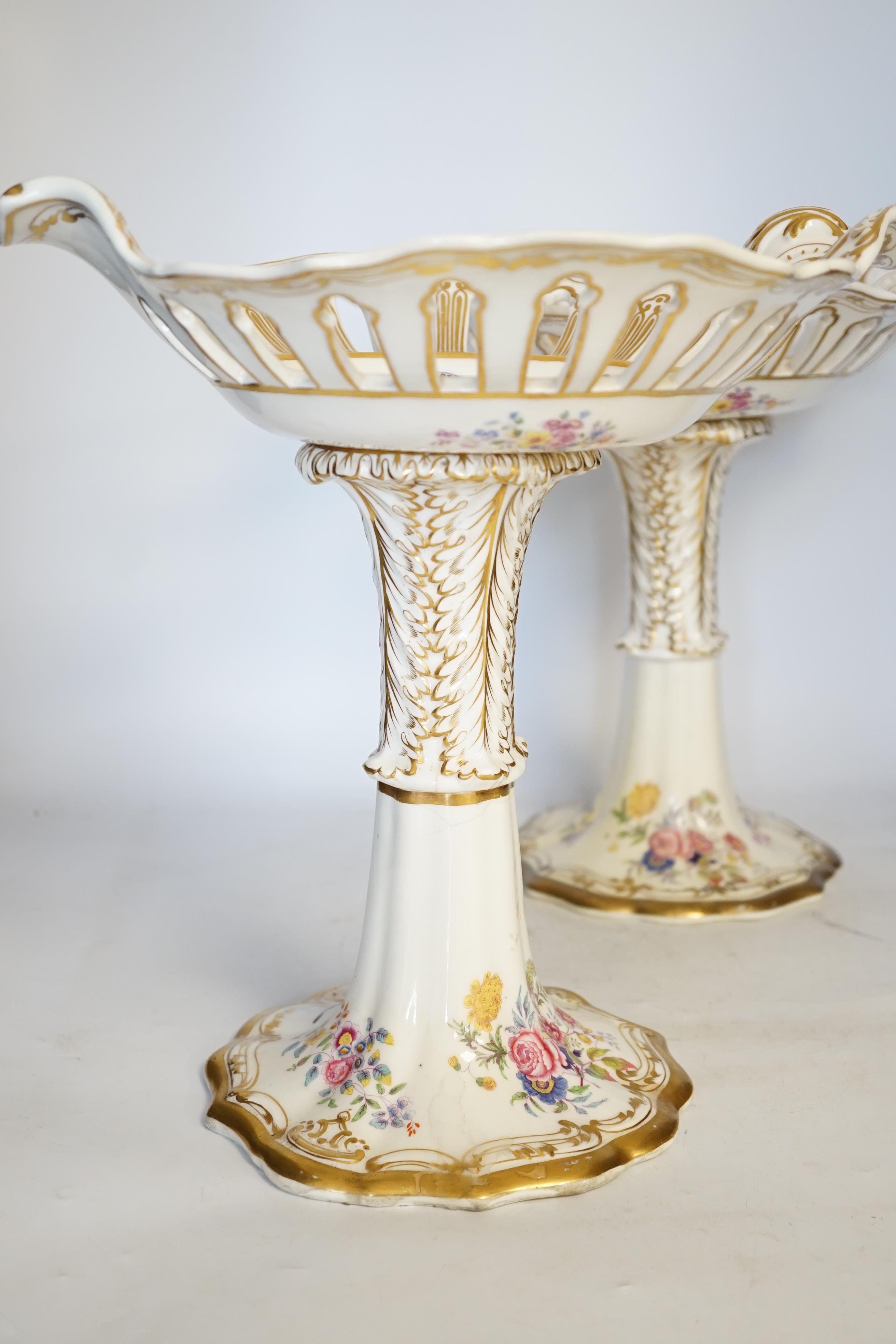 A pair of Copeland & Garrett porcelain crested comports in two parts, c.1840, 33cm. Condition - poor to fair